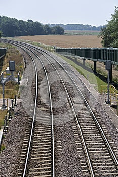 Close view of signals & curve in freight train track near Felixstowe. 