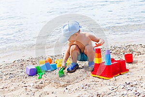 Close view of small boy having fun on a sandy beach
