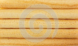 Close view of small dried breadsticks in rows