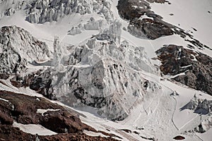 Close view of snowy and sheer cliff of the mountain