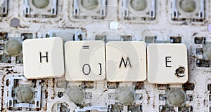 A close view of some keys on a dirty, yellowed keyboard.