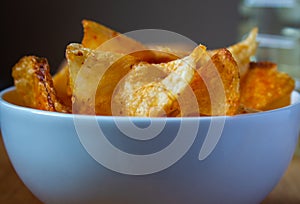 Close view of spicy potato chips in a bowl
