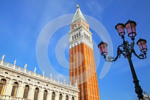 Close view of St Mark`s Campanile and Biblioteca at Piazzetta Sa