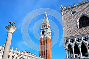 Close view of St Mark`s Campanile, Lion of Venice statue and Palazzo Ducale at Piazzetta San Marco in Venice, Italy