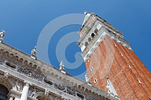 Close view of St Mark`s Campanile and Palazzo Ducale at Piazzetta San Marco in Venice, Italy