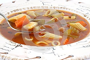 Close view of vegetable and pasta soup