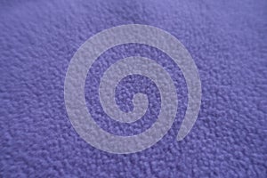Close view of violet fleece fabric