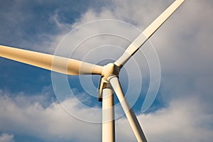 Close view of wind turbine at sunset