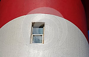 WINDOW IN A RED AND WHITE LIGHTHOUSE