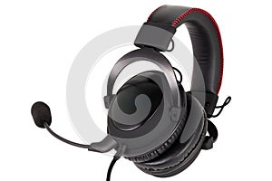 Close view of wired black gaming headphones with microphone isolated on white background