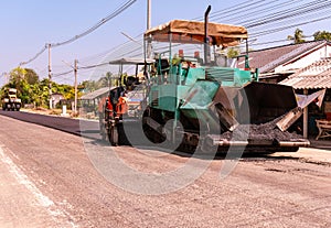 Close view on the workers and the asphalting machines, Workers making asphalt at road construction