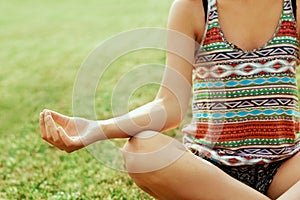 Closea up hands. Woman do yoga outdoor. Woman exercising vital and meditation