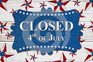 Closed 4th of July sign with USA flag stars