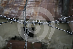 Closed area. Barbed wire, danger. Passage is prohibited. A blocked path