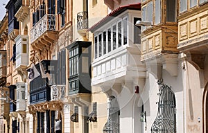 Closed balconies in the streets of Valletta , Malta