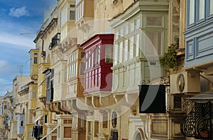 Closed balconies in the streets of Valletta , Malta