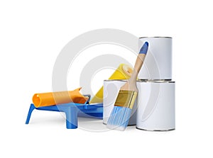 Closed blank cans of paint with brush, roller and tray on white