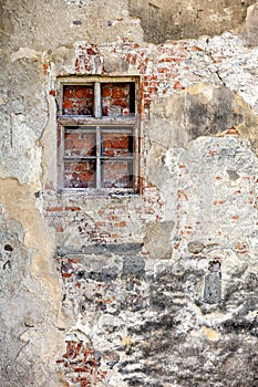 Closed blocked window and old wall