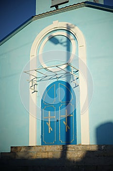 Closed blue arched doors to the Orthodox Church