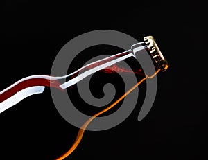 Closed bottle of beer on a black background.