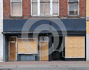 store with boarded up windows