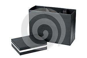 Closed cardboard box and a package of design paper black mockup.