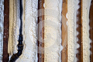 Closed cell spray foam insulation on a wall photo