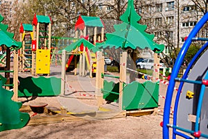 Closed children`s playground. COVID-19 security and protection measures in the city par