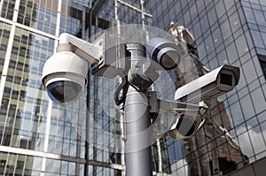 Closed circuit camera Multi-angle CCTV system against the backdrop of a modern city