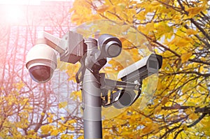 Closed circuit camera Multi-angle CCTV system against the background of yellow trees on a sunny autumn day