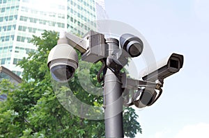 Closed circuit camera Multi-angle CCTV system on the background of a city