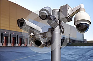 Closed circuit camera Multi-angle CCTV system on the background of the warehouse buildings