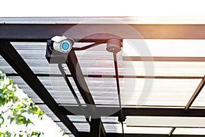 Closed circuit camera on the roof of home Security concept