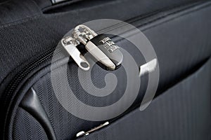 Closed combination lock on suitcase. Closeup of padlock locked on case, Safe travel concept