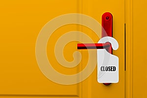 Closed door with a closed sign. Yellow door of a hotel, restaurant or bar with a red handle and a paper label with a warning