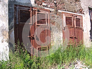 Closed door Old abandoned gloomy building unnecessary construction