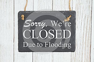 Closed Due to Flooding chalkboard sign