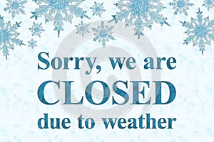 Closed due to weather sign with blue snowflake frame