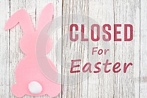 Closed for Eater sign with a bunny and on weathered wood