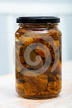 Closed glass jar with pickled lactarius deliciosus