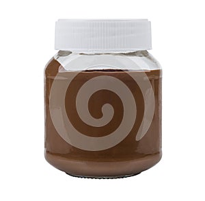 Closed glass transparent jar with nut-chocolate paste on white