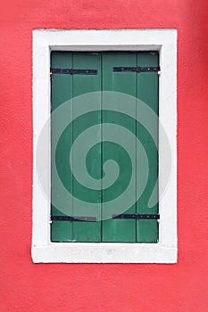 Closed green window shutters