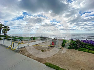 Closed La Jolla Beach with informative signage during COVID-19 pandemic.