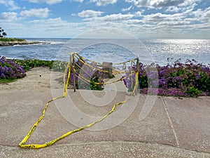 Closed La Jolla Beach with informative signage during COVID-19 pandemic.