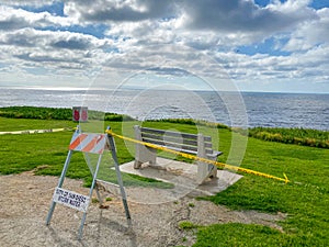 Closed La Jolla Beach with informative signage during COVID-19 pandemic.