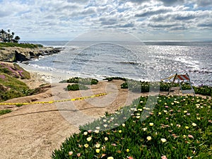 Closed La Jolla Beach with informative signage during COVID-19 pandemic.