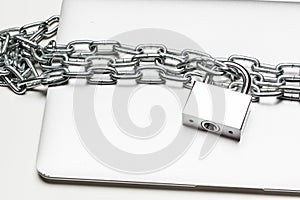 Closed laptop computer with chain