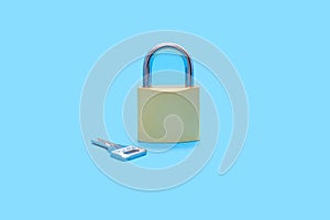 Closed lock with a key on a blue background