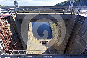 Closed locks of Zeya hydroelectric power station against the background of calm blue water.