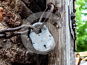 Closed metal padlock and chain